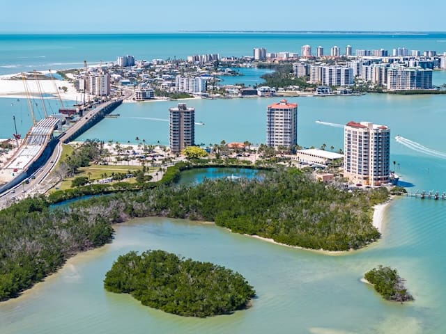 Aerial view of waterfront condos and mangroves